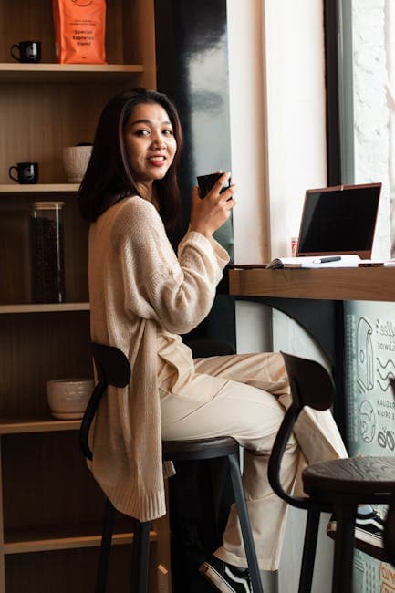 Outdoor cafe with laptop and coffee
