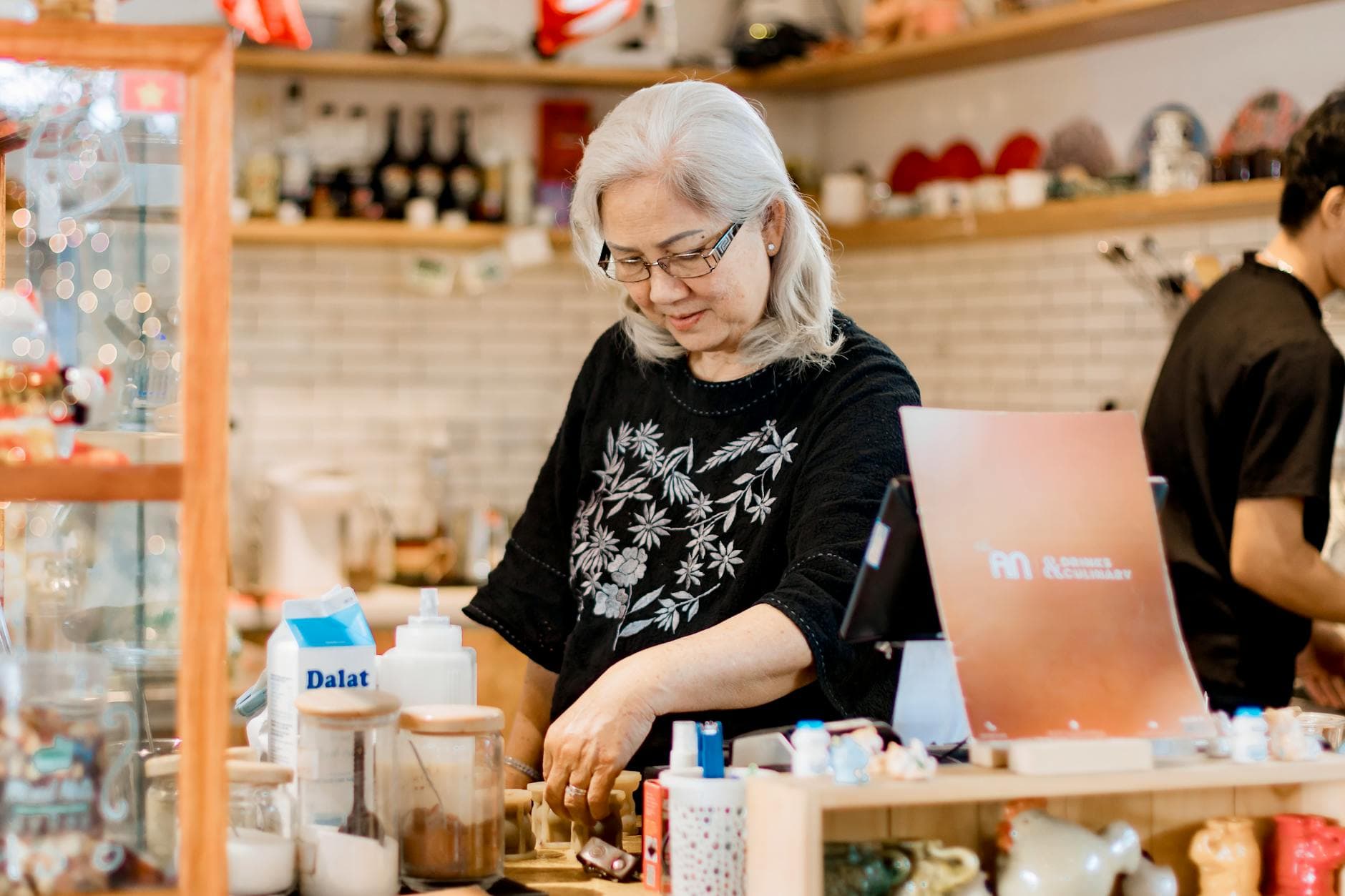 Small business owner working behind the counter