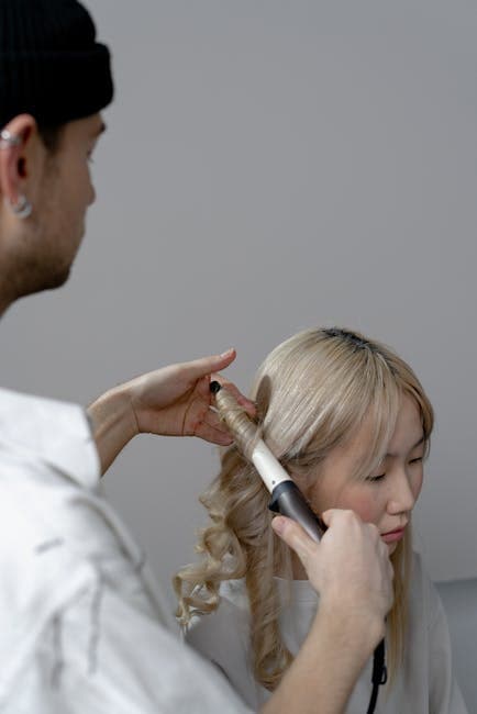 Hairstylist working with a client